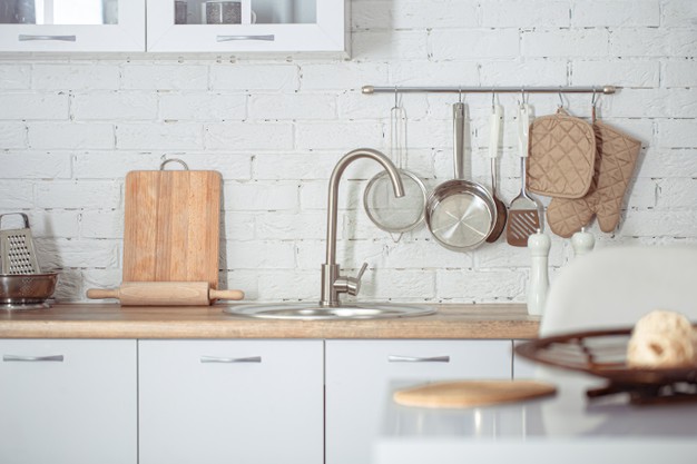 modern-stylish-scandinavian-kitchen-interior-with-kitchen-accessories-bright-white-kitchen-with-household-items_169016-4791